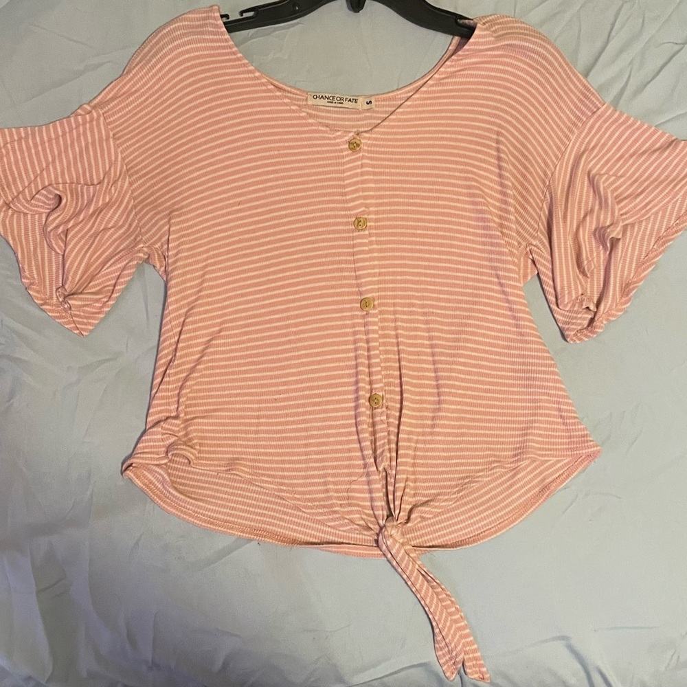 Pink and White stripped blouse, with buttons and tie bottom.